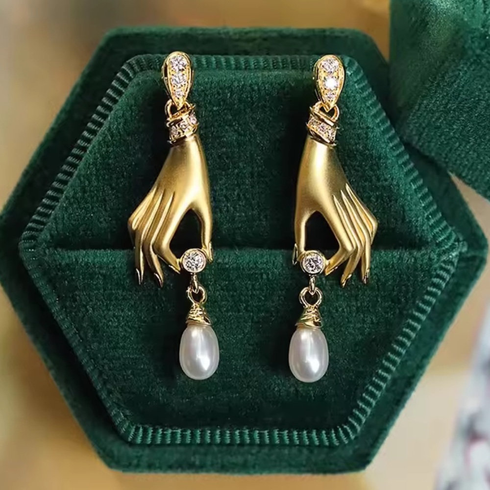 Anthropologie unique Gold Hand Earrings with Pearls